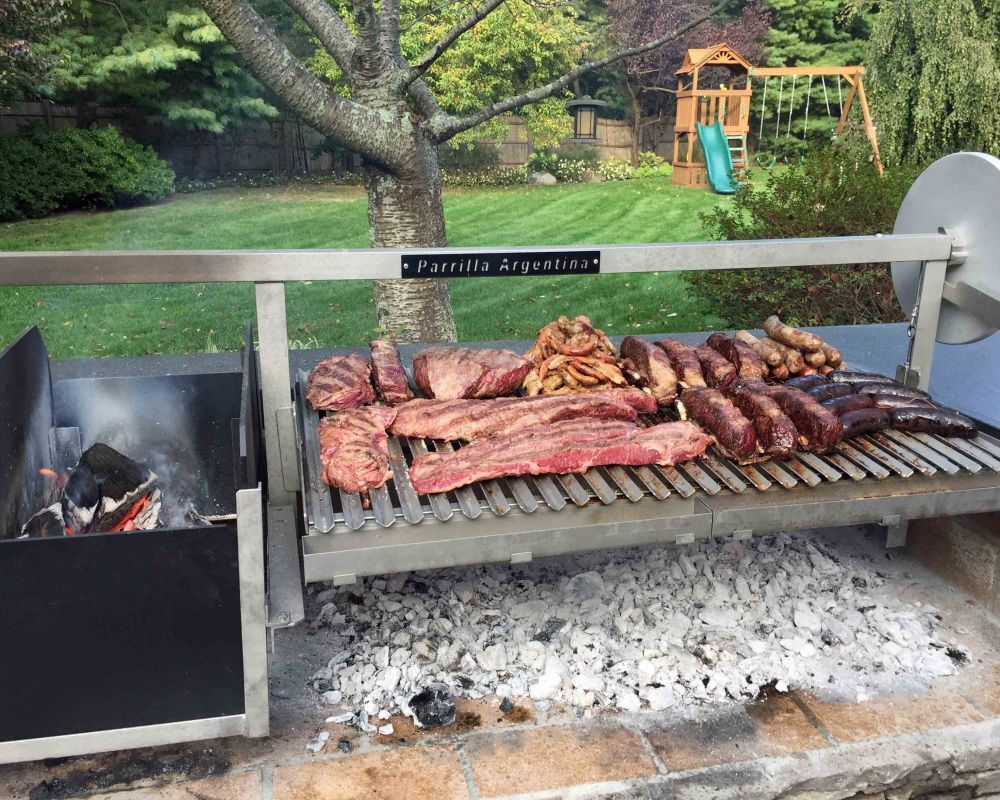 Asado cooking timeline from fire building to serving